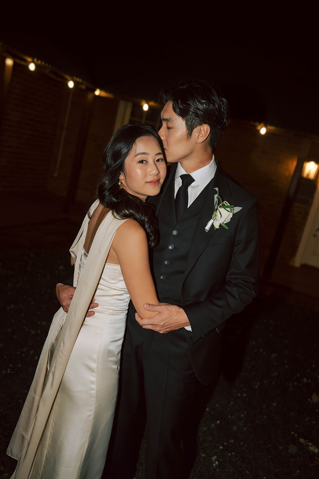 Bride and her groom in embrace